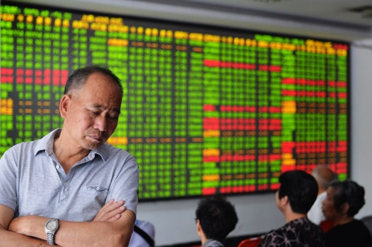 As yuan weakens, Chinese stock investors seek safety in Hong Kong