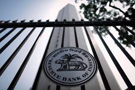 RBI holds rates; cheers markets by trimming inflation view
