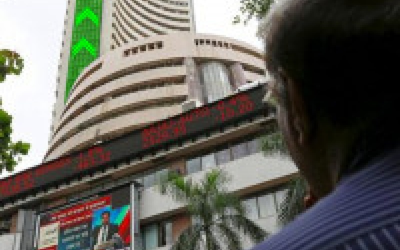 Rupee, heavyweights push Sensex, Nifty lower; PSU banks recover to end in the green