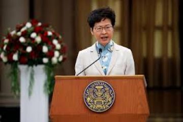 Hong Kong leader says U.S. law will hurt business confidence
