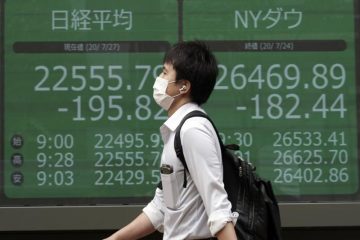 Asian Shares Advance After Wall St Rally; Gold Extends Gains