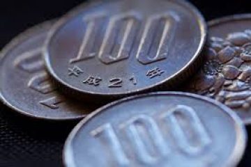 Yen sinks after BOJ sticks to ultra-easy policy