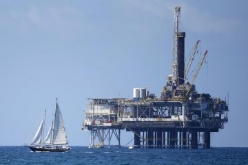 Oil edges higher but bleaker demand outlook weighs