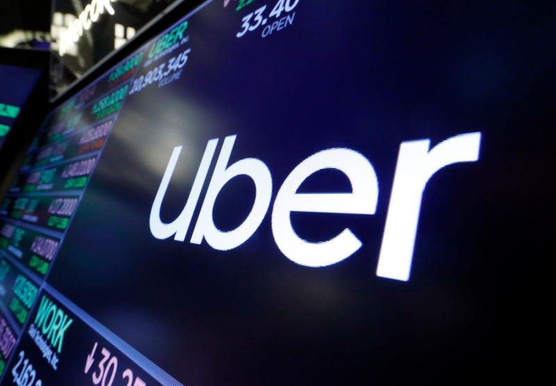 Uber forecasts first-ever adjusted profit, shares jump 7%